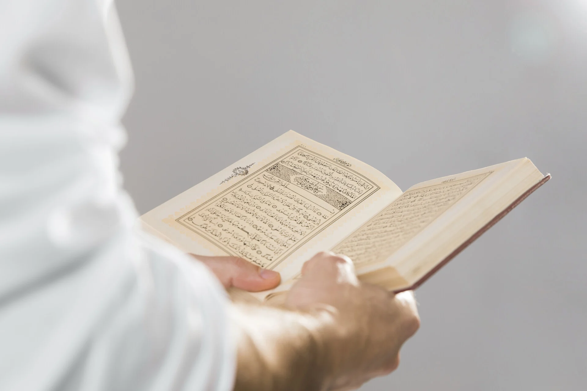 Religious Muslim Book Being Held Hands